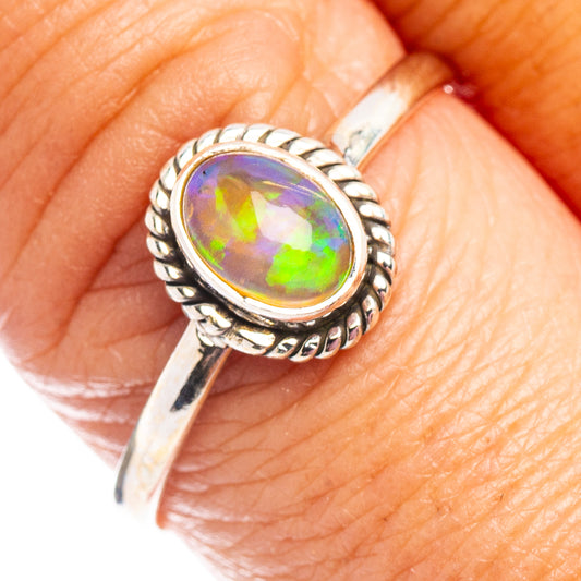 Sterling silver opal ring with oval multicolor opal, rope border and polished band