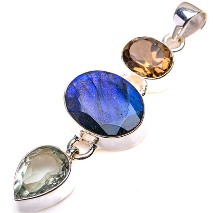 Sterling silver multi-gemstone pendant with large blue oval center and two smaller ovals