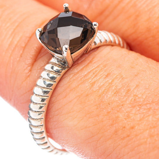 Sterling silver ring with dark faceted smoky quartz and ridged band, worn on finger