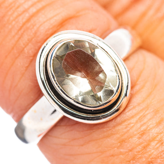 Sterling silver ring with oval blue topaz gemstone, size 7.5