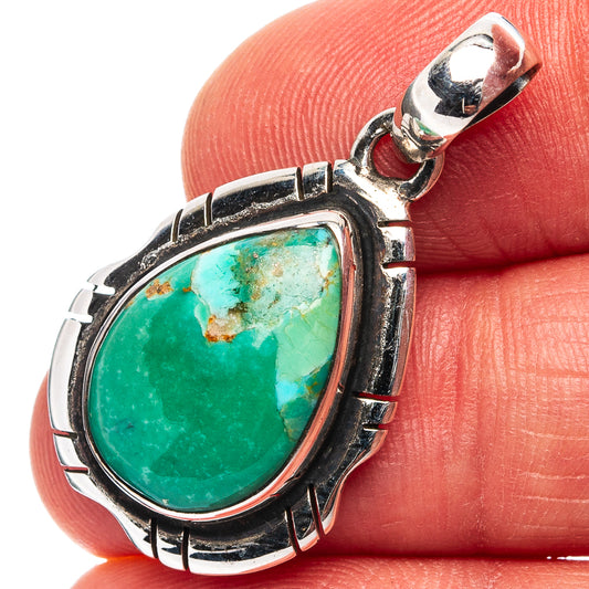 Turquoise oval pendant in .925 sterling silver with ornate bezel and bail