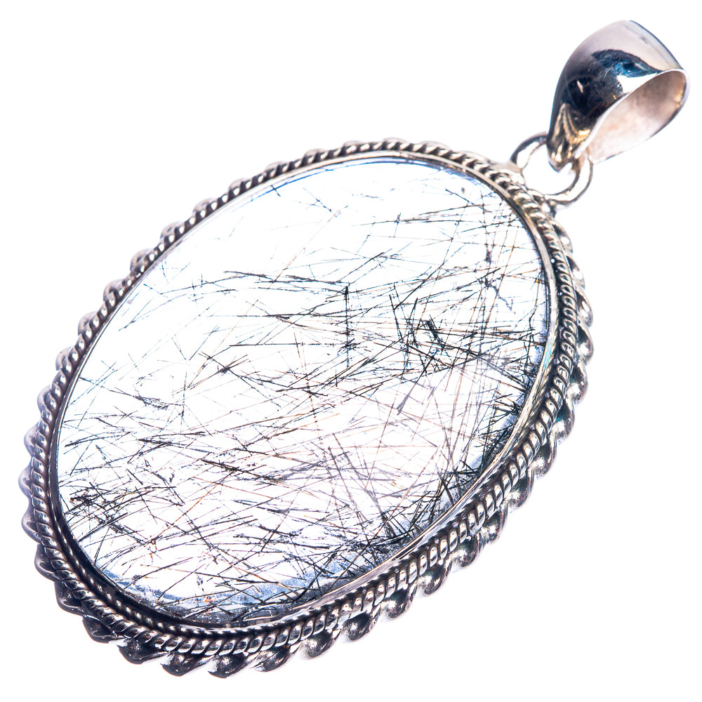 Oval sterling silver pendant with clear tourmalinated quartz cabochon, braided frame and loop bail