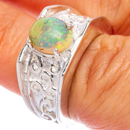 Sterling silver opal ring, green-orange cabochon on carved bezel