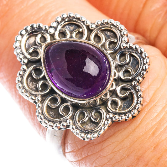 Size 7 sterling silver amethyst ring with oval purple gem and textured filigree edges