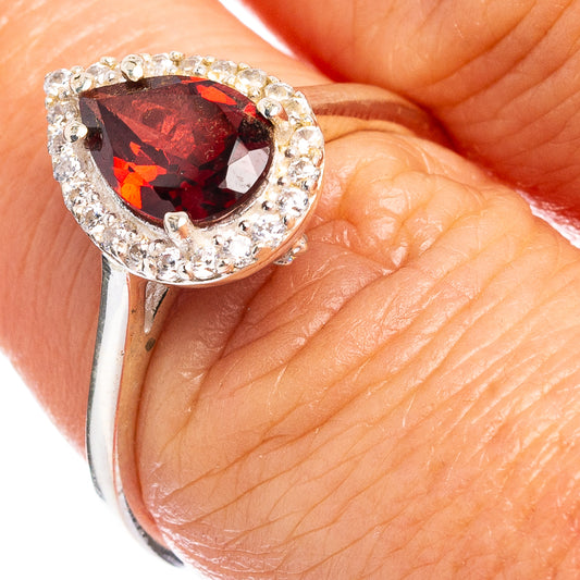 Garnet cubic zirconia halo ring in .925 sterling silver, pear-cut red stone