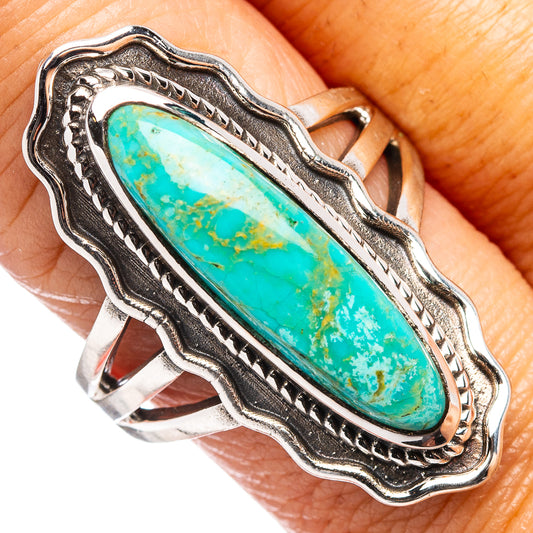 Turquoise oval ring close-up with rope detail bezel on sterling silver band