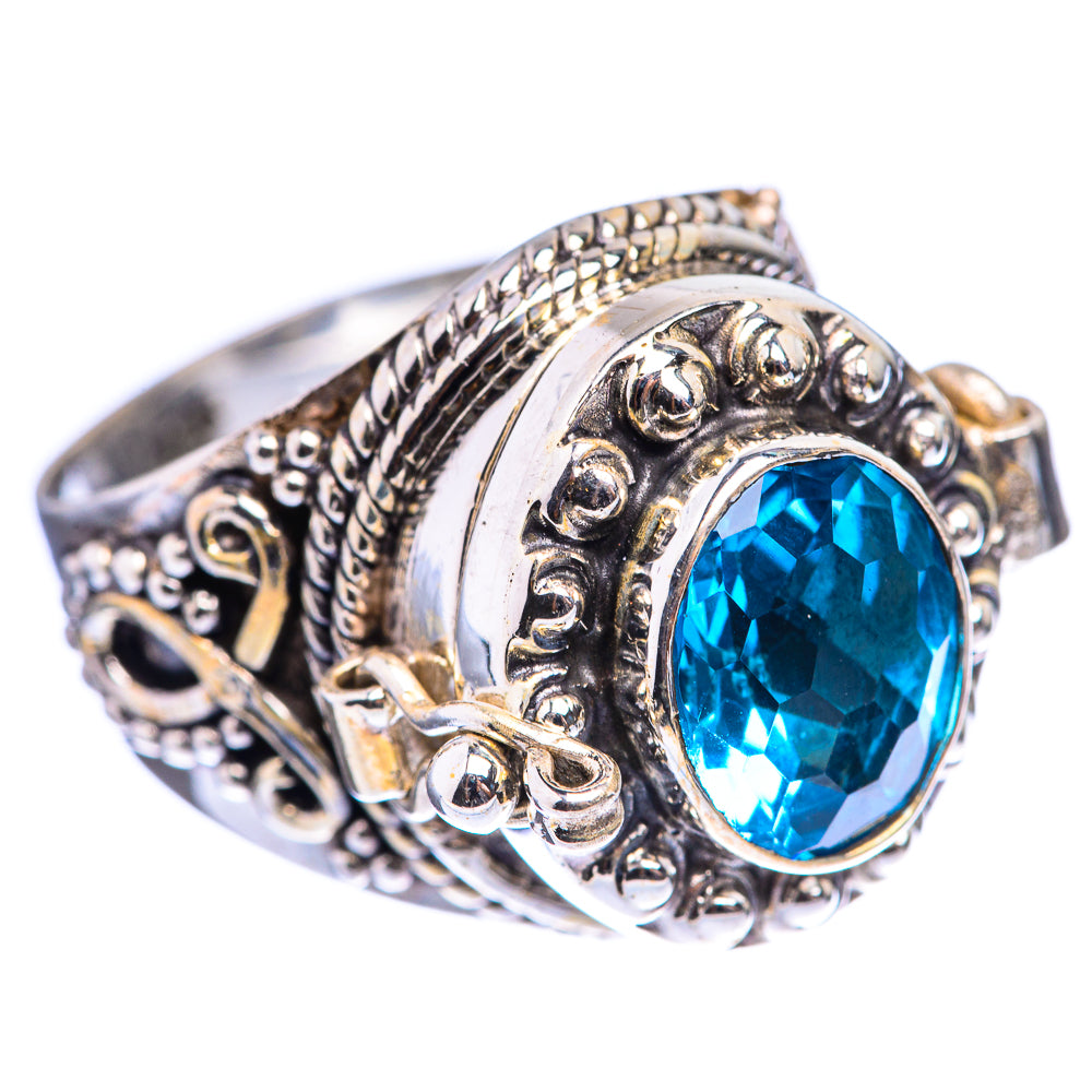 Sterling silver ornate ring with oval blue gemstone bezel setting