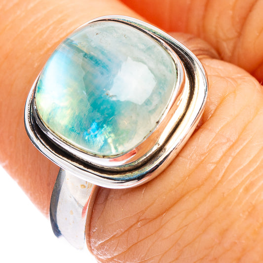925 sterling silver moonstone ring on hand, oval green-blue bezel setting