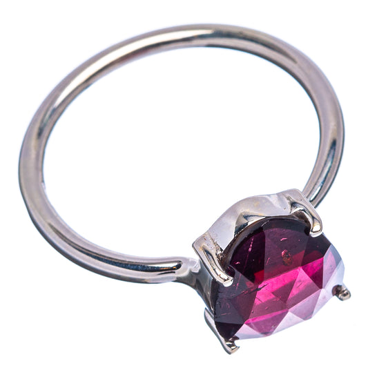 Oval faceted garnet ring, side view, silver band with raised prong-set gemstone