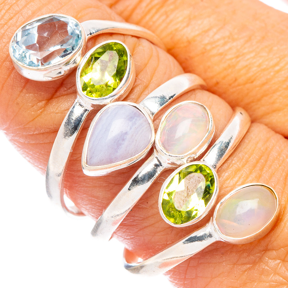 Sterling silver ring with three oval gemstones, green and light blue, split band