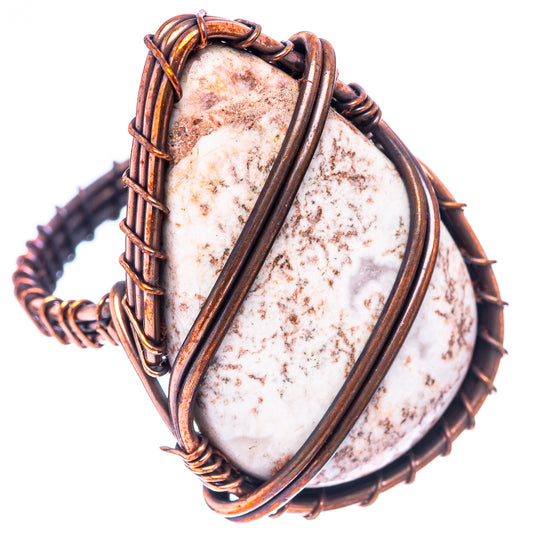 Oval speckled jasper set in dark oxidized copper wire with braided edges