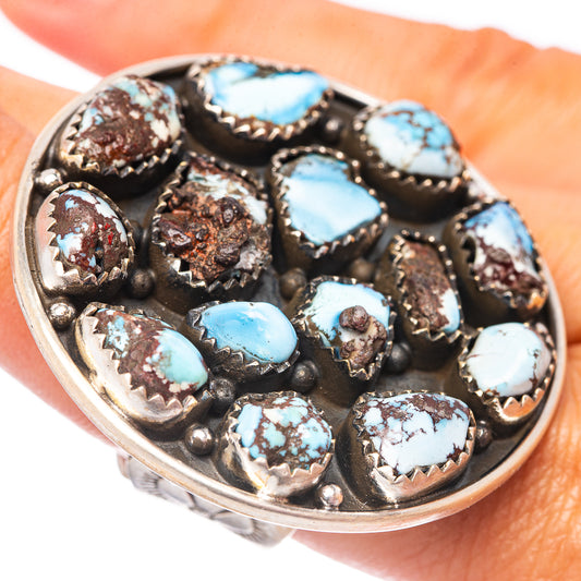 Oval turquoise cluster ring with multiple blue stones and detailed silver bezel settings