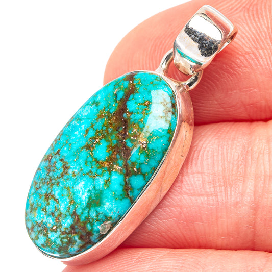 Oval turquoise pendant with .925 sterling silver bezel and bail, close-up view