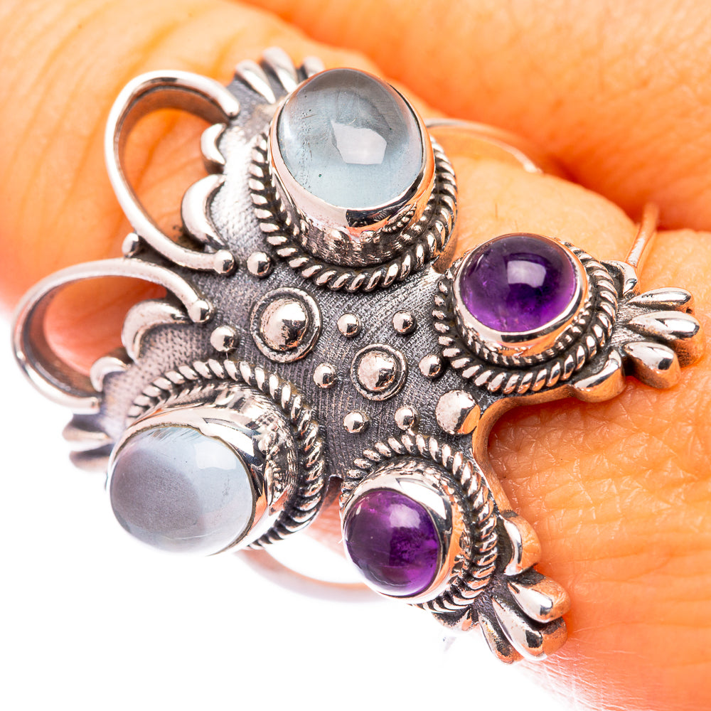 Size 9.5 silver ring with blue aquamarine center and purple amethyst side stones