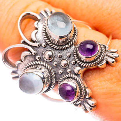 Size 9.5 silver ring with blue aquamarine center and purple amethyst side stones