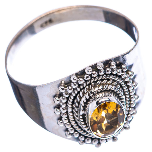 Sterling silver ring with yellow citrine stone in rope-bead setting, side view