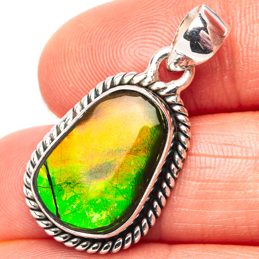 Sterling silver ammolite pendant with oval green-yellow gemstone in ornate bezel