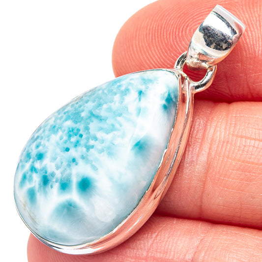 Larimar pendant close-up with hinged bail, blue marbled teardrop in .925 silver