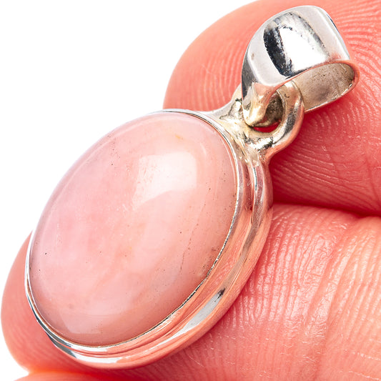 Pink oval opal pendant with .925 sterling silver bezel and bail, close-up on pink stone