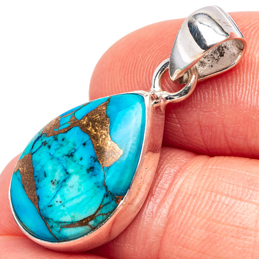 Turquoise teardrop pendant in .925 sterling silver with copper matrix accents