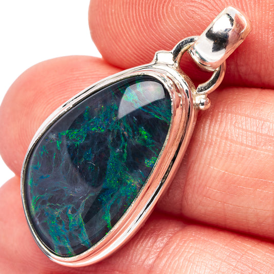 Sterling silver opal pendant with oval cabochon and raised bezel, silver loop bail