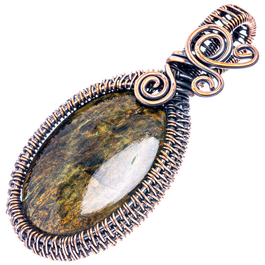 Oval petersite wire wrap pendant with oxidized copper spiral frame and top loop