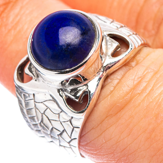 Sterling silver ring with oval blue lapis cabochon and filigree style setting