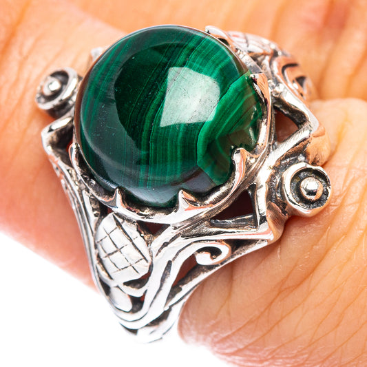 Sterling silver ring with round green malachite cabochon and detailed engraved design