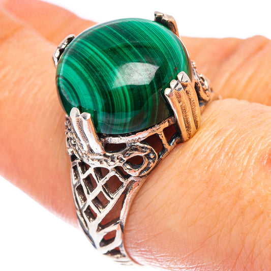 Sterling silver ring with oval green malachite cabochon and filigree bezel