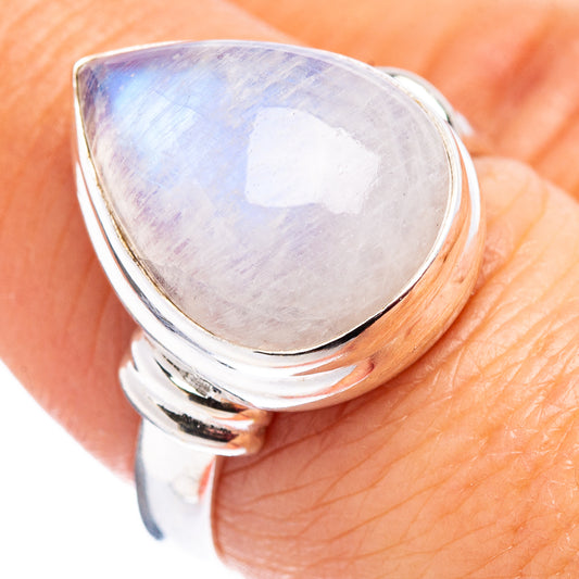 Sterling silver moonstone ring with pear-shaped iridescent white cabochon, split band