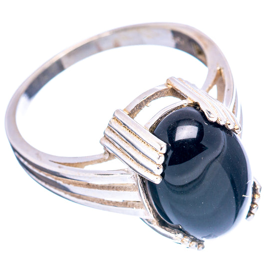 Sterling silver ring with oval black cabochon and bar-style filigree setting, side view