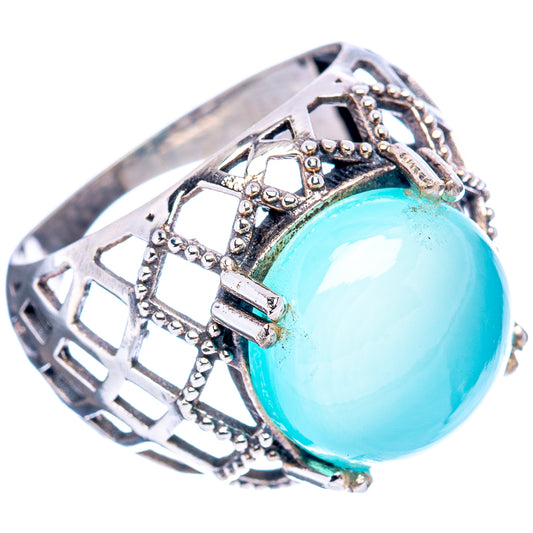 Sterling silver filigree ring with oval turquoise cabochon and geometric lattice top