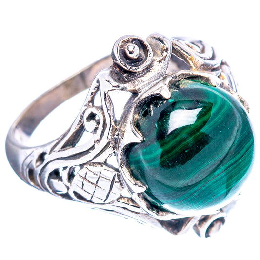 Sterling silver ring with round green malachite cabochon and ornate filigree