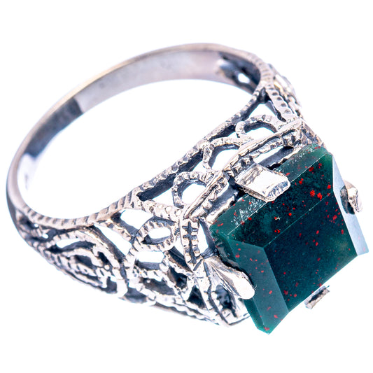 Sterling silver openwork filigree ring with dark green rectangular stone on band
