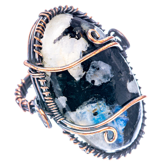 Oxidized copper wire-wrap ring with black tourmaline centerpiece and blue moonstone flash