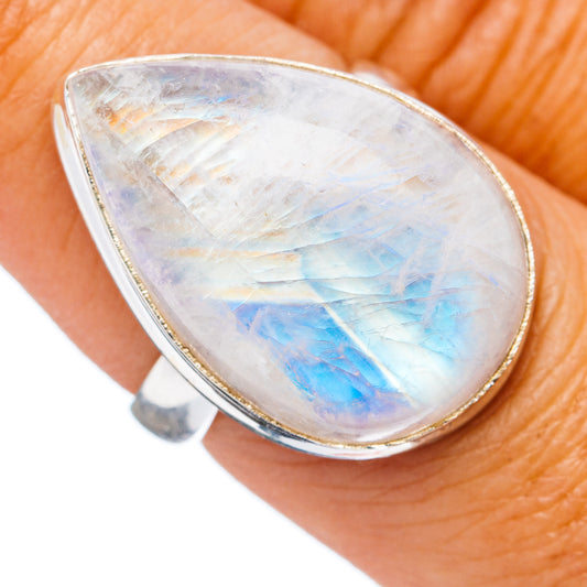 Oval moonstone ring in sterling silver, glowing blue flash on pear-cut iridescent stone