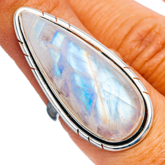 Teardrop moonstone ring in sterling silver with blue iridescent center, open band