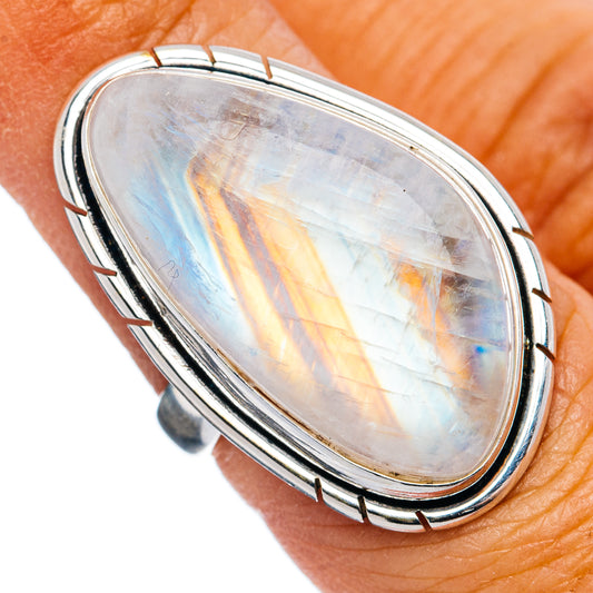 Oval opalescent moonstone ring with polished .925 sterling silver bezel and rainbow sheen
