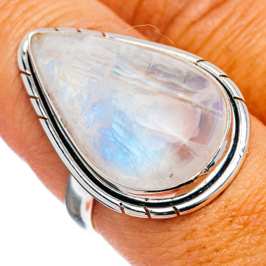 Sterling silver moonstone ring with pear-shaped rainbow sheen stone, on hand