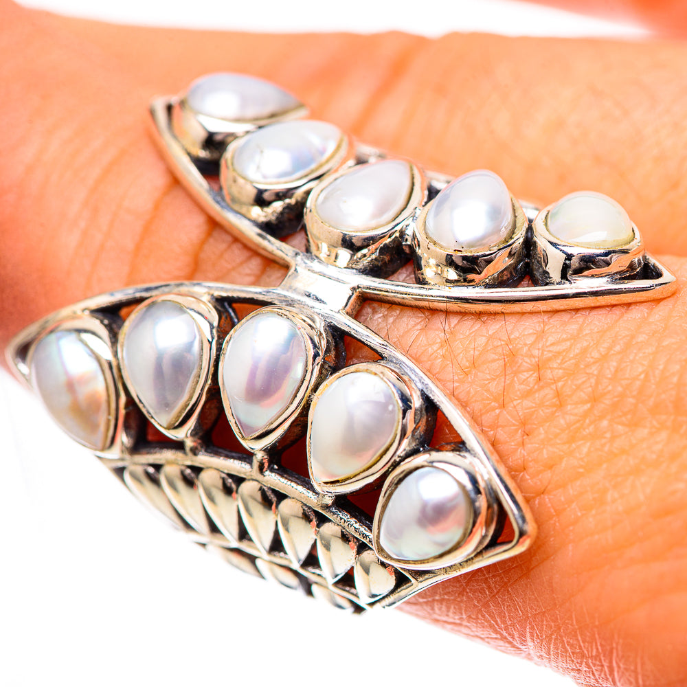 Polished 925 sterling silver ring with oval cultured pearl stones, prong-set