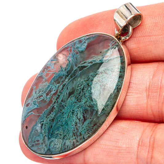 Oval moss agate pendant with teal-green veined stone and .925 sterling silver bail