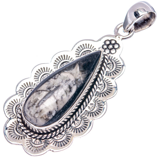 Sterling silver fossil pendant with blue-gray oval stone, detailed floral border, bail