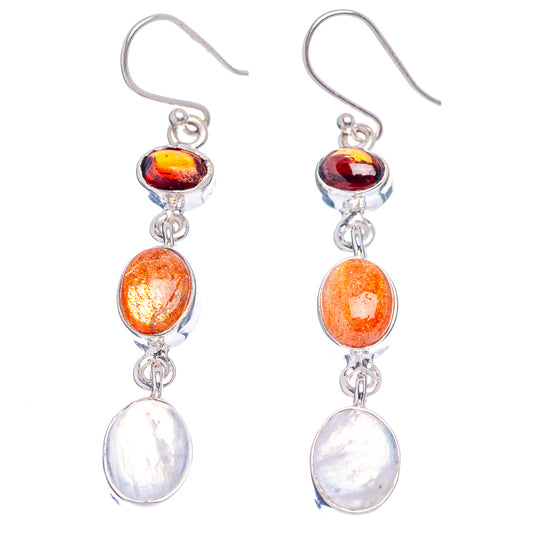 Sterling silver drop earrings with red-orange top stone, orange sunstone, and white moonstone