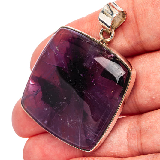 Amethyst pendant with dark purple rectangular stone in sterling silver bezel