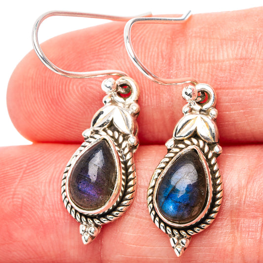 Close-up sterling silver labradorite drop earrings, blue flash teardrop stone