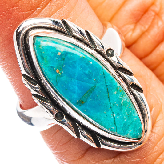 Oval turquoise-blue opal ring in .925 sterling silver with ornate raised bezel