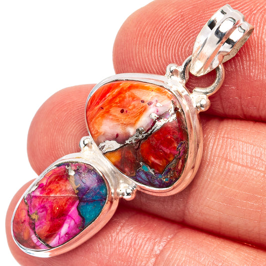 Sterling silver oval pendant with two multicolor stone insets and top bail