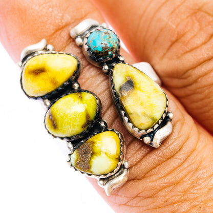 Adjustable .925 sterling silver ring with oval yellow stones and small turquoise center