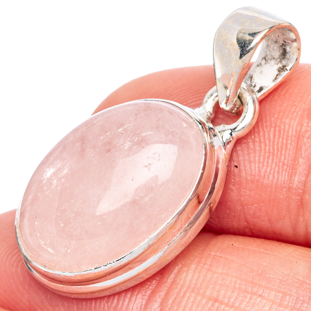 Oval pink gemstone pendant in sterling silver, with hinged bail detail