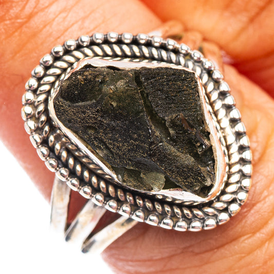 Sterling silver moldavite ring with dark green teardrop stone and beaded bezel